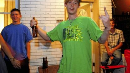 Dan Lalisnock, 21, a senior at the University of Pittsburgh, parties on the porch with friends along Atwood Street.