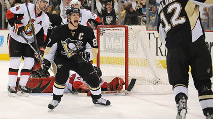 The Penguins' Sidney Crosby celebrates game winning goal by Ryan Malone in the third period against the resurgent Senators in Game Two last night at Mellon Arena.