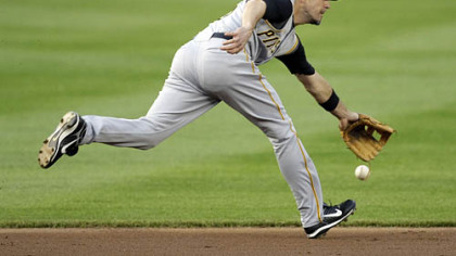 Pittsburgh Pirates shortstop Chris Gomez misses a grounder hit by Washington Nationals Felipe Lopez during the first inning of an MLB baseball game, Thursday in Washington.