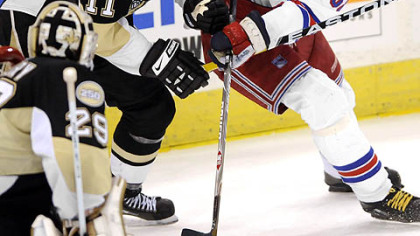 Rangers Jaromir Jagr tries to work around Penguins Jordan Staal to the net in the second period Sunday.