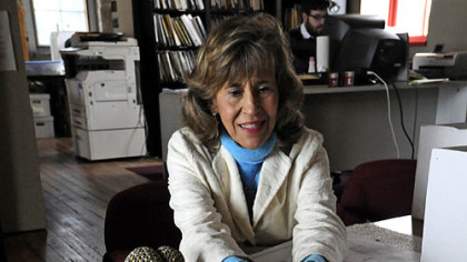 Archaeologist Christine Davis holds the head of a porcelain doll made in the 1850s by Germany's Kestner & Co.
