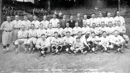 Group picture of the Pirates as 1925 World Series Champions
Left to right: Back row: Chick Fraser, scout; Bill Hinchmand, scout; Jack Onslow, coach; Clyde Barnhart, left fielder; Eddie Moore, second baseman; Emil Yde, pitcher; Sam Watters, secretary; Barney Dreyfuss, president and owner; Sam Dreyfuss, treasurer; Johnny Rawlings, infielder; Vic Aldridge, pitcher, Babe Adams, pitcher, Johnny Morrison, pitcher; Lee Meadows, pitcher. Middle row: Earl Smith, catcher; Geroge Haas, outfielder; John (Red) Oldham, pitcher; Fresco Thomapson, infielder;  Joh (Stuffy) McInnis, first baseman; Max (Scoops) Carey, center fielder; Bill McKenchnie manager; Fred Clarke, vice president;Glenn Wright, shortstop; George Grantham, second baseman; Carson (Skeeter) Bigbee, left fielder; Old (Pie) Traynor, third baseman. Front row: Johnny Gooch, catcher; Roy Spencer, catcher, Bernard (Bud) Colloton, pitcher; Jewel Ens, coach; (holding Bill McKechnie Jr.);Hazen Cuyler, right fielder; Remy Kremer, pitcher; Tom Sheehan, pitcher.