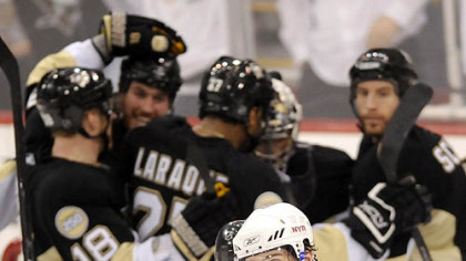 A dejected Rangers Jaromir Jagr leaves the ice as the Penguins celebrates their 5-4 victory.