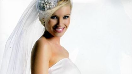 One of the newest designs by Motherhood Maternity is this ruffle-tiered chiffon cupcake bridal dress in bright white.