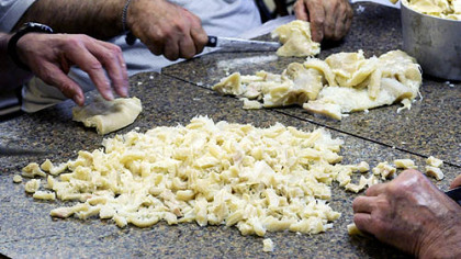 Preparation for the monthly tripe dinner at the Italian Club in Muse includes cutting up tripe after it is cooked. It will be served in marinara sauce prepared by the club's ladies auxiliary. The club has been serving tripe for more than 50 years.