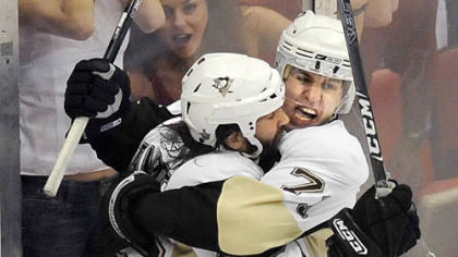 Evgeni Malkin and Maxime Talbot celebrate the tying goal against the Red Wings in the third period.