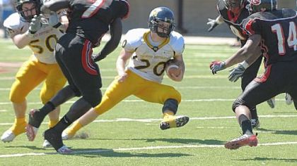 Thomas Jefferson's Brian Baldrige looks for breathing room against Cleveland Glenville yesterday in Wheeling, W.Va.