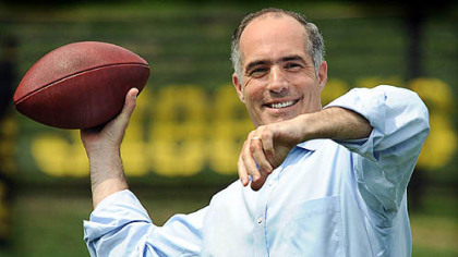Senator Robert  P. Casey Jr drops back to pass at Steelers training camp.