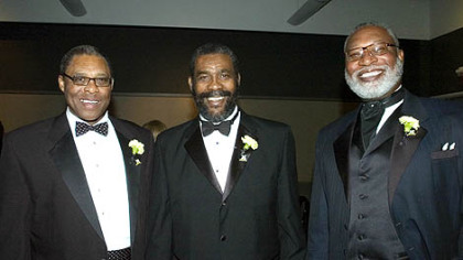 Former Steelers Dwight White, Joe Green, and L.C. Greenwood share a moment at the Steelers 75th Gala event at the David L. Lawrence Convention Center in 2007