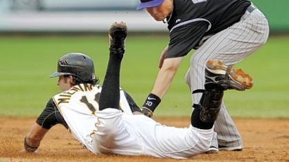 Doug Mientkiewicz slides safely into second ahead of the tag by Colorado's Jeff Baker. Mientkiewicz got a double on the play.