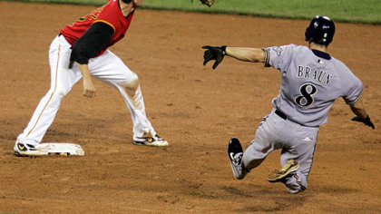 Second baseman Freddy Sanchez, left, waits for the late throw from center field as Milwaukee Brewers' Ryan Braun (8) slides into second with an eighth-inning double last night at PNC Park.