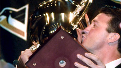 Mario Lemieux kisses the trophy honoring him as the the all-time greatest athlete at last night's Dapper Dan Dinner held at the David L. Lawrence Convention Center Downtown.