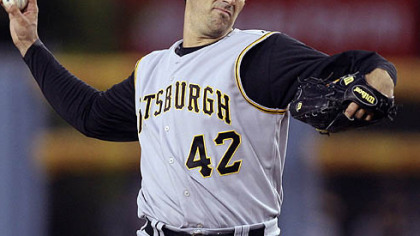 Matt Morris throws to the Los Angeles Dodgers during the first inning of their baseball game in Los Angeles last night. The Dodgers and Pirates celebrated the 61st anniversary of Jackie Robinson breaking baseball's color barrier with uniformed personnel wearing his number 42.