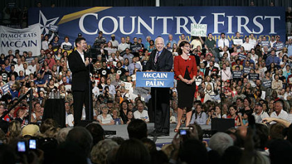 Republican presidential candidate Sen., John McCain, R-Ariz., center, and his vice presidential running mate, Alaska Gov. Sarah Palin, right, with her husband Todd Palin, left, address supporters during a campaign rally at Franklin & Marshall College in Lancaster yesterday.