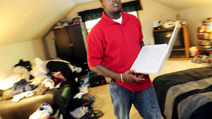 Laptop in hand, Bobby Franklin moves about his room at this parent's home in Plum.  A recent graduate of Clarion, Mr. Franklin says his dream job would be in pharmaceutical sales.