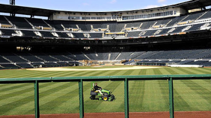 The outfield of PNC Park get trimmed up as the ballpark is whipped into shape for the home opener on Monday.