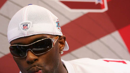 Plaxico Burress speaks during Giants media day for Super Bowl XLII at University of Phoenix Stadium.