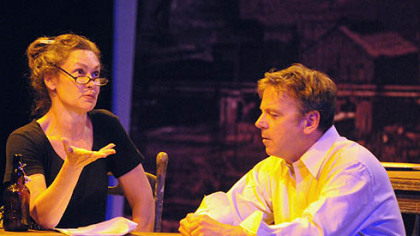 Debra Gordon, left, plays Dorta Dubik, and Paul Ford is Mike Dobrejcak in the Unseam'd Shakespeare production of "Out of This Furnace," opening tomorrow at Open Stage Theatre.
