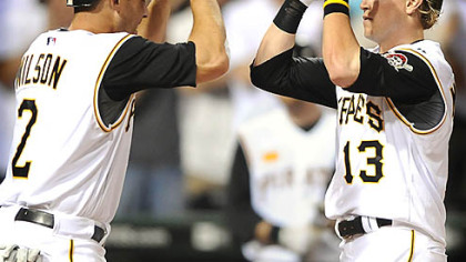 Pirates Nate McLouth is greeted at home by Jack Wilson after hitting a game-winning two run homer against the Yankees in the 7th inning at PNC Park last night.