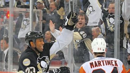 Winger Georges Laraque celebrates his third-period goal against the Islanders last night at Mellon Arena.
