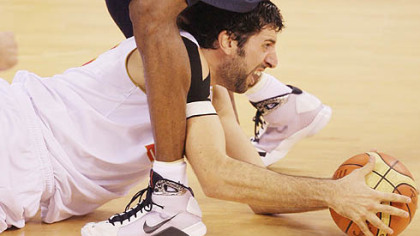 BEIJING -- Spain's Alex Mumbru battle for a ball under Kobe Bryant in the men''s gold medal basketball game. The United States won gold reclaiming their status after loosing it in the 2004 games.