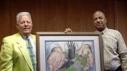 Butler artist Willie F. Hobbs, right, and his painting that will be part of the Flight 93 Memorial at Shanksville. Butler County Commisionier Dale Pinkerton, who helped campaign to get the painting included in the memorial, is on the left.
