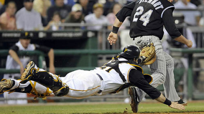 Pirates catcher Ryan Doumit stretches out to tag out Colorado's Ian Stewart near third base to end the sixth inning last night at PNC Park.