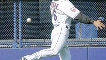 Mets left fielder Angel Pagan misplays a fly ball hit by Nate McLouth in the sixth inning yesterday - just one of several misplays by the Mets yesterday in the Pirates' 13-1 rout.
