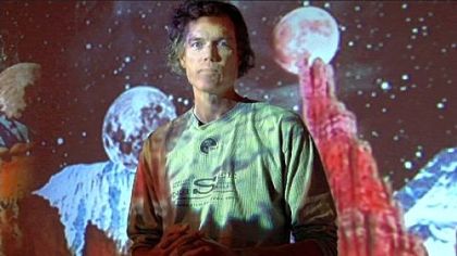 Charlie Humphrey, executive director of Pittsburgh Filmmakers, the Pittsburgh Center for the Arts and the Pittsburgh Glass Center, becomes a human projection screen while standing amid Matthew Barton's mixed-media installation, "The Affects of the Effects of Gravity." It was part of the Pittsburgh Center for the Arts/Pittsburgh Filmmakers 2008 Biennial.