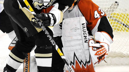 Penguins Ryan Malone tries to get in front of Flyers Martin Biron in the first period Sunday.