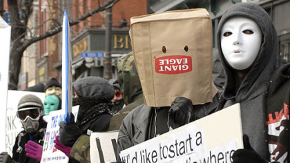 Protesters rally outside the Church of Scientology's South Side office yesterday.