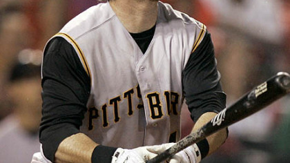 Ryan Doumit watches his two-run home run during the third inning  against the Cardinals.