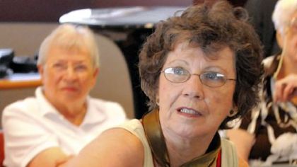Dorothy Kinkus, of Cannonsburg, uses her backhand in an friendly game of "Wii Sports" at the Peters library.
