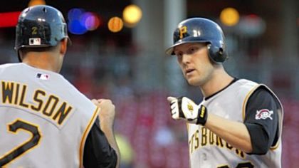 Jack Wilson congratulates Jason Bay after Bay hit a two-run home run in the fourth inning last night in Cincinnati.