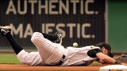 First baseman Doug Mientkiewicz dives but can't come up with a ball hit by St. Louis batter Chris Duncan in the Cardinals' four-run fourth inning yesterday at PNC Park. Duncan's double drove in Troy Glaus with the first of the Cardinals' 11 runs.
