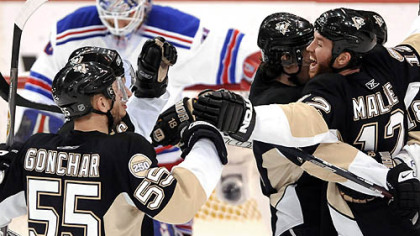 Penguins teammates celebrate Marian Hossa's first-period goal.