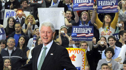 Former President Bill Clinton acknowledges the crowd upon his arrival at the Henry Gymnasium on the campus of  Washington & Jefferson College.