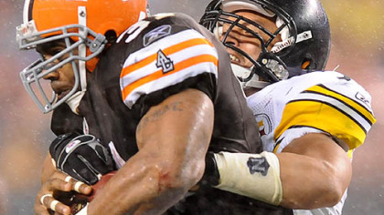James Farrior stops the Browns' Jamal Lewis for a short gain.