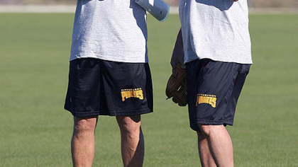 Pitching coach Jeff Andrews  and manager John Russell observe players warming up on the field at Pirates City for the first morning of a mini-camp in Bradenton.--photo by Tiffany Tompkins-Condie/ttompkins@bradenton.com
