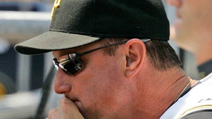 Pirates manager John Russell looks on from the dugout during a 3-1 loss to the San Diego Padres yesterday at PNC Park.