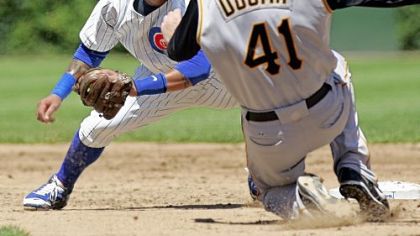 Cubs second baseman Ronny Cedeno prepares to tag out Ryan Doumit on an attempted steal of second  in the third inning.