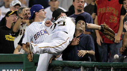 First baseman Adam LaRoche falls into the stands attempting to catch a sixth inning foul ball last night at PNC Park.