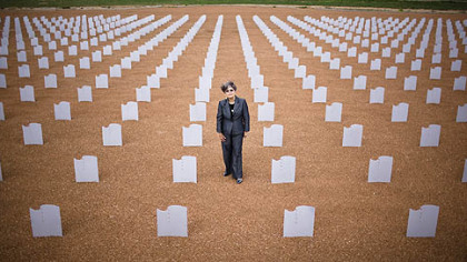 MORIARITY, N.M. -- Sonja Britton, president of the Memorial of Perpetual Tears-New Mexico National DWI Victims' Memorial, stands in the middle of a memorial to victims of drunken drivers.