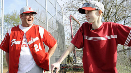 John Challis talks with Freedom High School head baseball coach Steve Wetzel after a game April 24.