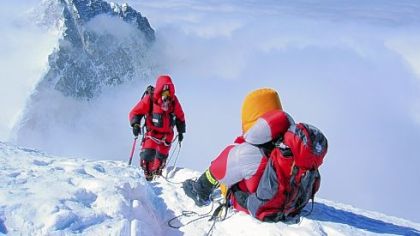 Lhotse looms behind Will Cross during an earlier climb up Mount Everest. This view shows the couloir on the face of Lhotse, an alleyway that climbers use to reach the peak.