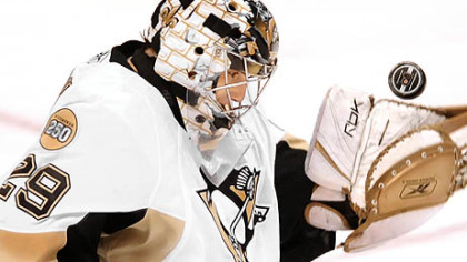 Penguins goalie Marc-Andre Fleury makes a save against the Flyers' Mike Richards.