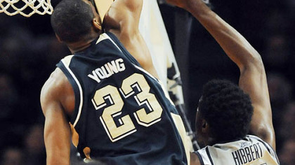 Sam Young, who came up big for Pitt in all four games, blocks yet another shot -- this one by Georgetown center Roy Hibbert. He blocked 10 shots in the tournament.