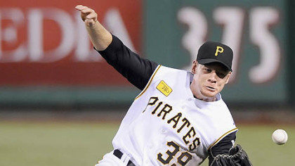 Brandon Moss can't come up with a ball hit by the Cubs' Derrek Lee in the fifth inning last night.
