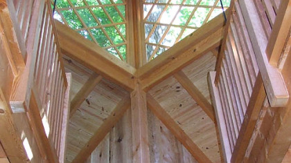 The Douglas fir timbers that make up the columns, beams and rafters of the two-story Canopy Cathedral treehouse were milled from logs recovered from a 2002 wildfire in Oregon.