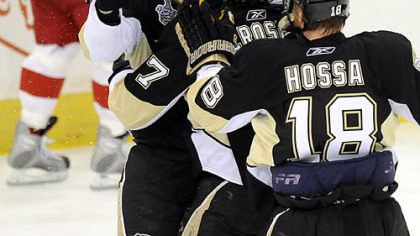 The Penguins' Jarkko Ruutu and Marian Hossa congratulate Sidney Crosby on his goal in the first period Wednesday night.